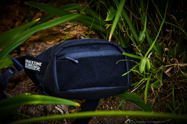 Snacktime Sling™ (X-PAC - Black / Light Grey Inner)